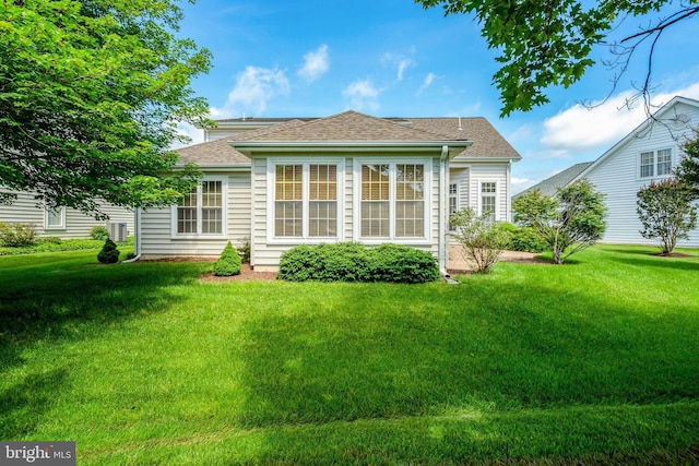 13854 Cinch Ln, Gainesville, VA 20155 - rear view of property featuring a lawn and a shingled roof