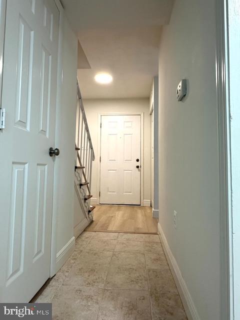 7851 W Point Ct, Manassas, VA 20109 - hallway featuring stairs and baseboards