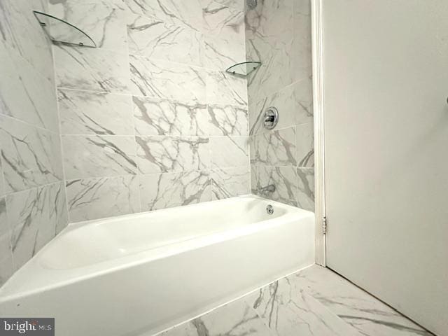 7851 W Point Ct, Manassas, VA 20109 - bathroom with marble look tile flooring and bathing tub / shower combination