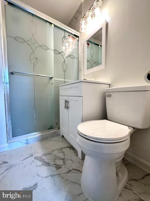 7851 W Point Ct, Manassas, VA 20109 - full bath with marble finish floors, vanity, and a shower stall
