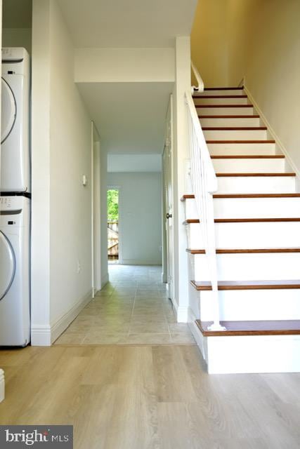 7851 W Point Ct, Manassas, VA 20109 - staircase with wood finished floors and stacked washing machine and dryer