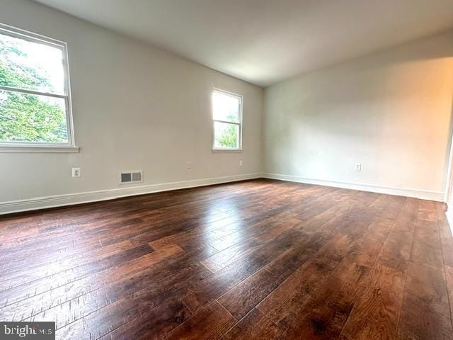7851 W Point Ct, Manassas, VA 20109 - empty room with dark wood finished floors and baseboards