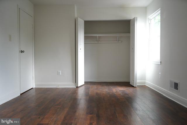7851 W Point Ct, Manassas, VA 20109 - unfurnished bedroom with hardwood / wood-style flooring and a closet
