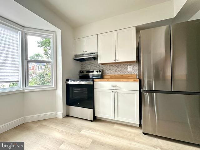 7851 W Point Ct, Manassas, VA 20109 - kitchen featuring stainless steel appliances, under cabinet range hood, light wood-style flooring, and healthy amount of natural light