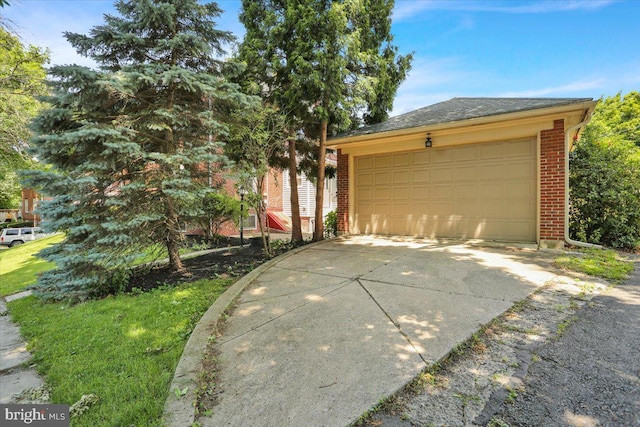 23 Trebor Pl, Reading, PA 19610 - view of front of property featuring brick siding, a garage, an outbuilding, and roof with shingles