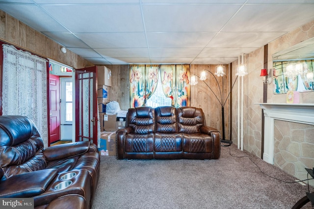 930 Elm St, Reading, PA 19601 - carpeted living room featuring wood walls and a fireplace