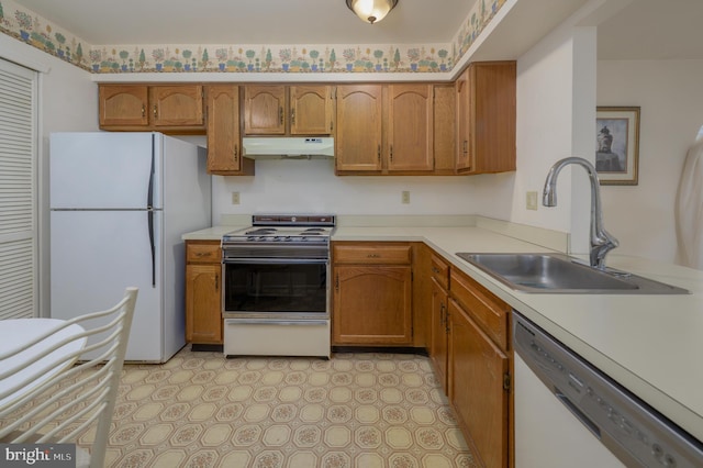 3808 Adelaide Dr, Mount Laurel, NJ 08054 - kitchen featuring white appliances, under cabinet range hood, light countertops, and brown cabinets