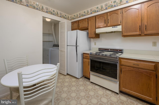 3808 Adelaide Dr, Mount Laurel, NJ 08054 - kitchen with white appliances, under cabinet range hood, light countertops, and brown cabinets