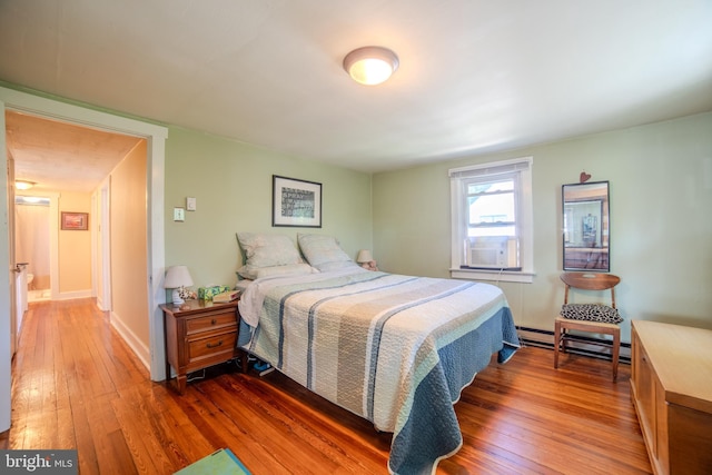 38 E Old Baltimore Pike, Media, PA 19063 - bedroom featuring a baseboard heating unit, hardwood / wood-style flooring, and cooling unit