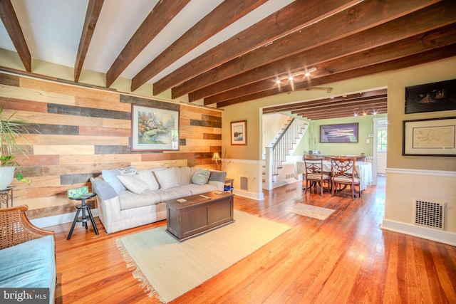 38 E Old Baltimore Pike, Media, PA 19063 - living room with stairway, wood walls, beam ceiling, and wood finished floors