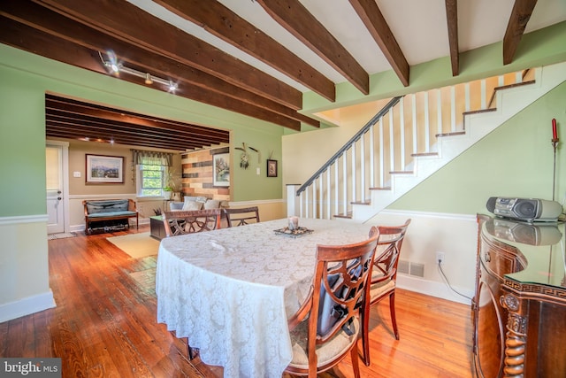 38 E Old Baltimore Pike, Media, PA 19063 - dining space with beamed ceiling, wood finished floors, and stairway