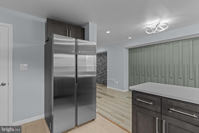 3647 Friar Rd, Philadelphia, PA 19154 - kitchen with freestanding refrigerator, light tile patterned floors, recessed lighting, and dark brown cabinetry