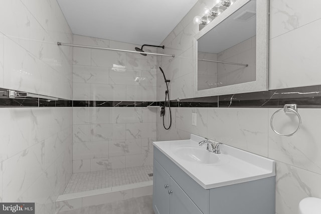 3647 Friar Rd, Philadelphia, PA 19154 - bathroom featuring a tile shower, tile walls, and vanity