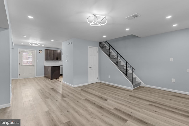 3647 Friar Rd, Philadelphia, PA 19154 - unfurnished living room with stairs, light wood-style floors, and recessed lighting