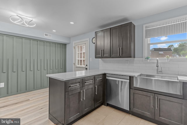 3647 Friar Rd, Philadelphia, PA 19154 - kitchen with stainless steel dishwasher, a peninsula, light countertops, backsplash, and recessed lighting