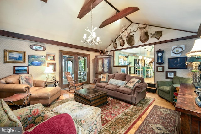 201 Laurence Dr, Moorestown, NJ 08057 - living area featuring a chandelier, wood finished floors, wallpapered walls, and french doors