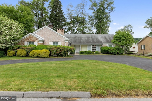 418 1st Ave, Clearfield, PA 16830 - view of front of house featuring a front yard, a chimney, and asphalt driveway