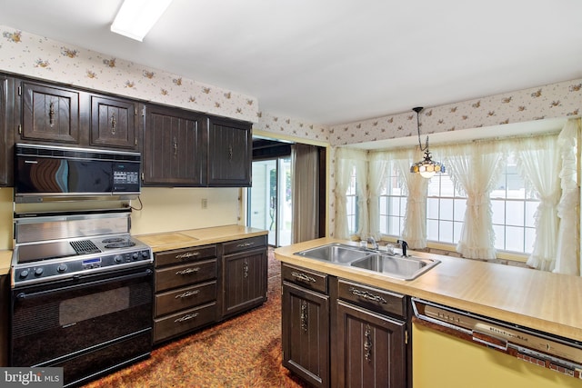 418 1st Ave, Clearfield, PA 16830 - kitchen with black appliances, plenty of natural light, light countertops, wallpapered walls, and pendant lighting