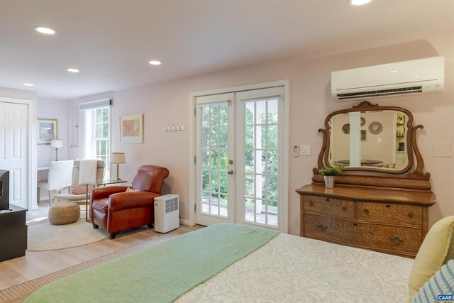 220 Buttercup Ln, Charlottesville, VA 22902 - bedroom with a wall mounted air conditioner, access to outside, recessed lighting, wood finished floors, and french doors