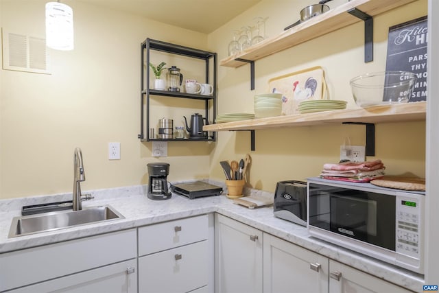 220 Buttercup Ln, Charlottesville, VA 22902 - kitchen with open shelves and white cabinets