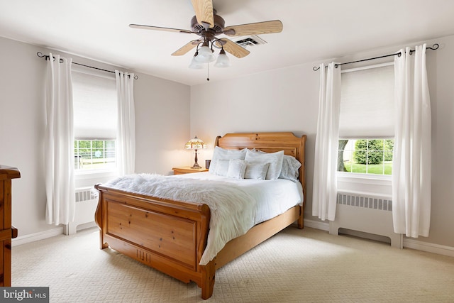 1512 Marsh Rd, Wilmington, DE 19803 - bedroom featuring radiator heating unit, multiple windows, and carpet flooring