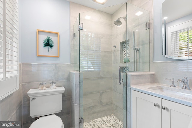 1512 Marsh Rd, Wilmington, DE 19803 - bathroom featuring tile walls, vanity, and a stall shower