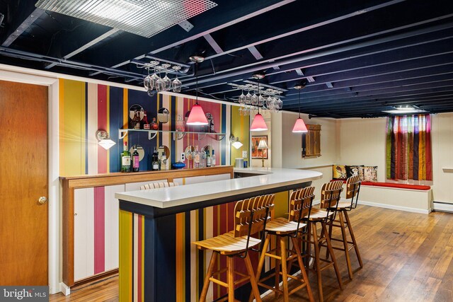 1512 Marsh Rd, Wilmington, DE 19803 - indoor dry bar with wood finished floors and a baseboard heating unit