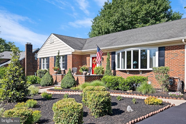 1512 Marsh Rd, Wilmington, DE 19803 - ranch-style house with brick siding, roof with shingles, and a chimney
