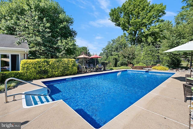 1512 Marsh Rd, Wilmington, DE 19803 - view of swimming pool featuring a patio, outdoor dining space, and a diving board