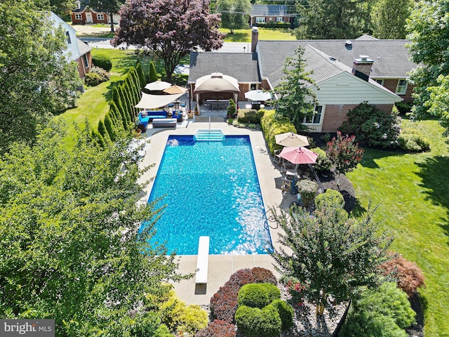 1512 Marsh Rd, Wilmington, DE 19803 - outdoor pool featuring a gazebo, a diving board, a patio area, an outdoor hangout area, and view of wooded area