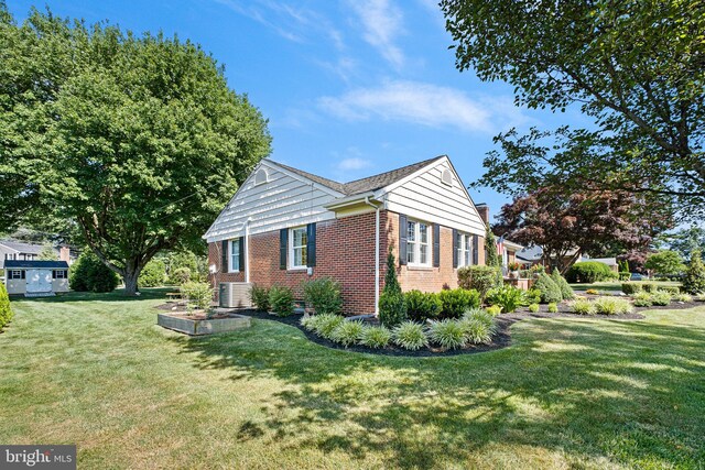 1512 Marsh Rd, Wilmington, DE 19803 - view of property exterior featuring brick siding and a yard