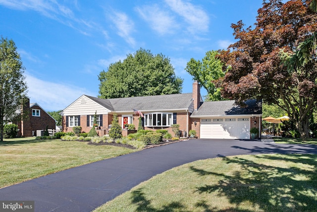 1512 Marsh Rd, Wilmington, DE 19803 - ranch-style home with brick siding, driveway, a front yard, an attached garage, and a chimney