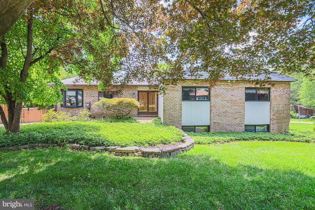 7119 Pheasant Cross Dr, Baltimore, MD 21209 - view of front of home featuring brick siding and a front yard