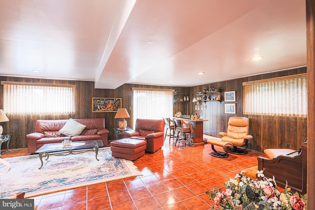 7119 Pheasant Cross Dr, Baltimore, MD 21209 - tiled living area featuring healthy amount of natural light and wood walls