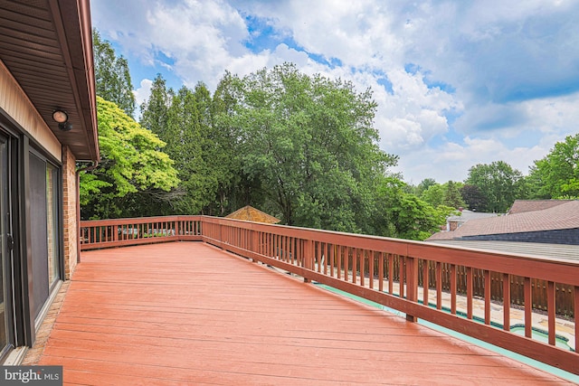 7119 Pheasant Cross Dr, Baltimore, MD 21209 - wooden terrace with view of wooded area and an outdoor pool