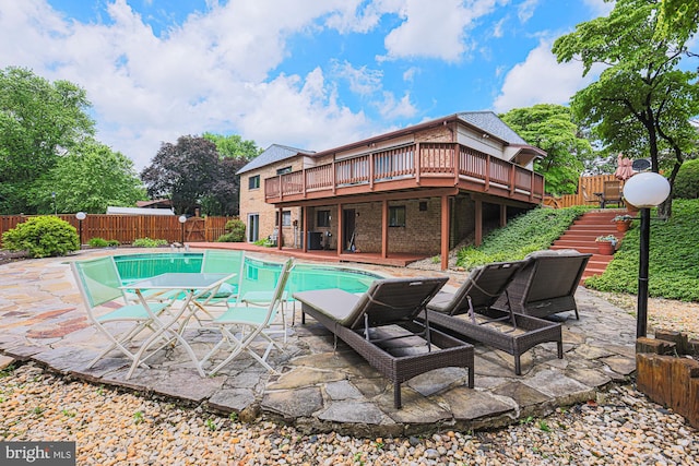 7119 Pheasant Cross Dr, Baltimore, MD 21209 - view of pool featuring a wooden deck, stairway, a fenced backyard, and a patio
