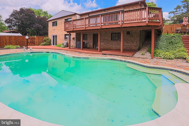 7119 Pheasant Cross Dr, Baltimore, MD 21209 - view of swimming pool featuring a wooden deck, a fenced backyard, a diving board, and a patio area