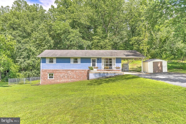 7918 Wicker Ln, La Plata, MD 20646 - ranch-style home featuring a storage unit, covered porch, brick siding, and driveway