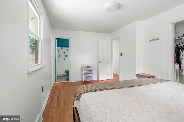 7918 Wicker Ln, La Plata, MD 20646 - bedroom featuring wood finished floors, a closet, and a spacious closet