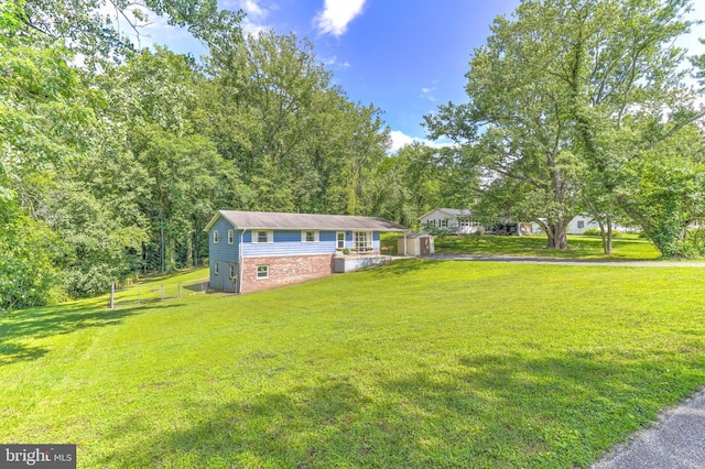 7918 Wicker Ln, La Plata, MD 20646 - view of front facade with a shed, a front yard, and driveway