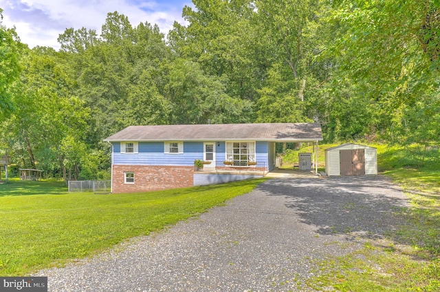 7918 Wicker Ln, La Plata, MD 20646 - ranch-style home featuring a storage unit, driveway, a carport, a front yard, and brick siding