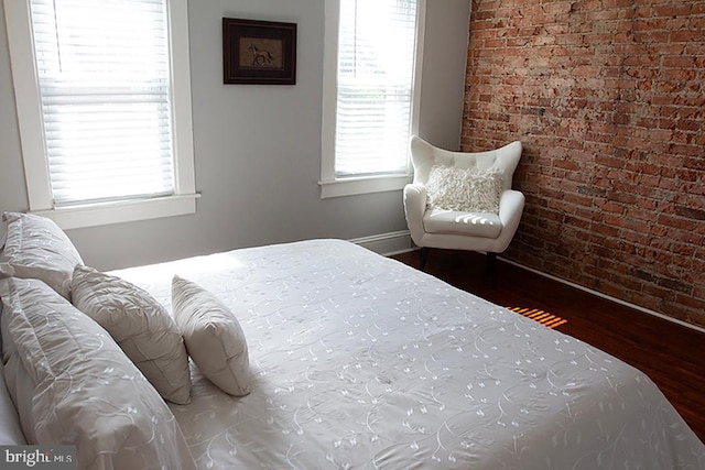 736 Seitz St, Easton, PA 18042 - bedroom featuring wood finished floors and brick wall