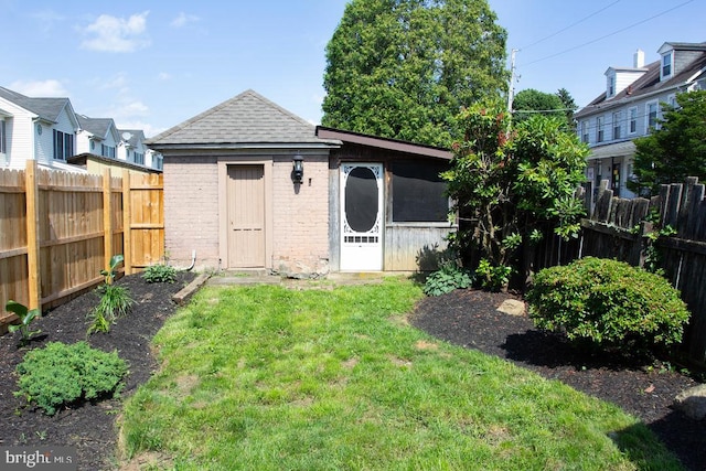 736 Seitz St, Easton, PA 18042 - rear view of property featuring brick siding, a fenced backyard, and a shingled roof
