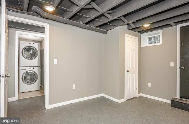 4352 Sheldon Ave, Baltimore, MD 21206 - basement featuring stacked washer / drying machine and baseboards