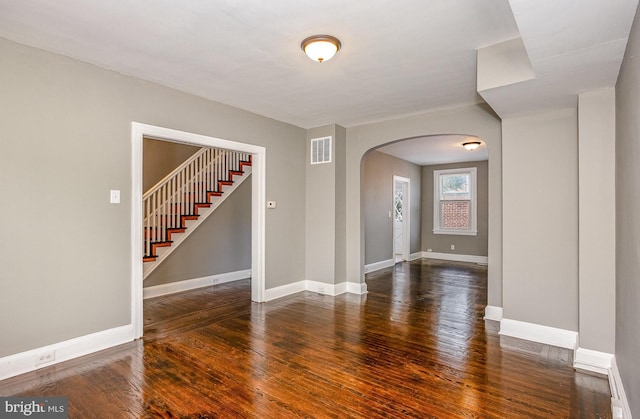 4352 Sheldon Ave, Baltimore, MD 21206 - unfurnished room with arched walkways, wood finished floors, and stairway