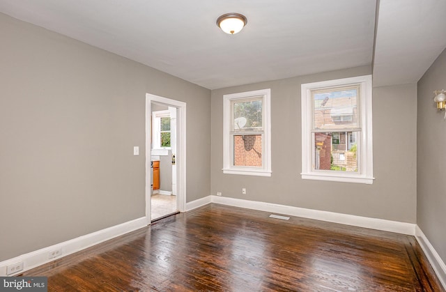 4352 Sheldon Ave, Baltimore, MD 21206 - spare room featuring baseboards and dark wood finished floors