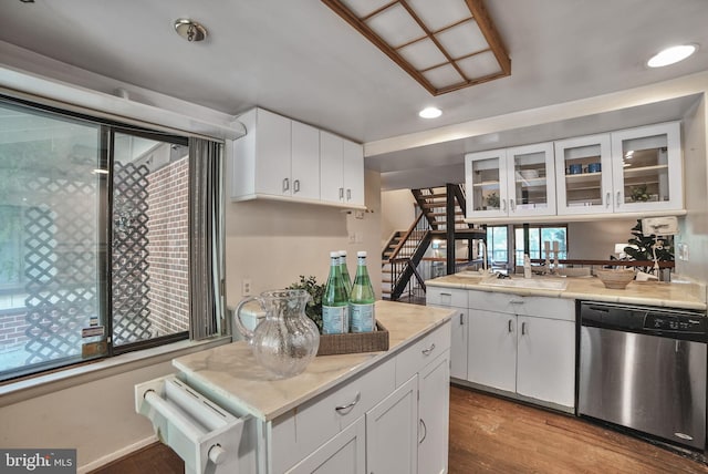 20207 Laurel Hill Way, Germantown, MD 20874 - kitchen with stainless steel dishwasher, recessed lighting, light countertops, wood finished floors, and glass insert cabinets