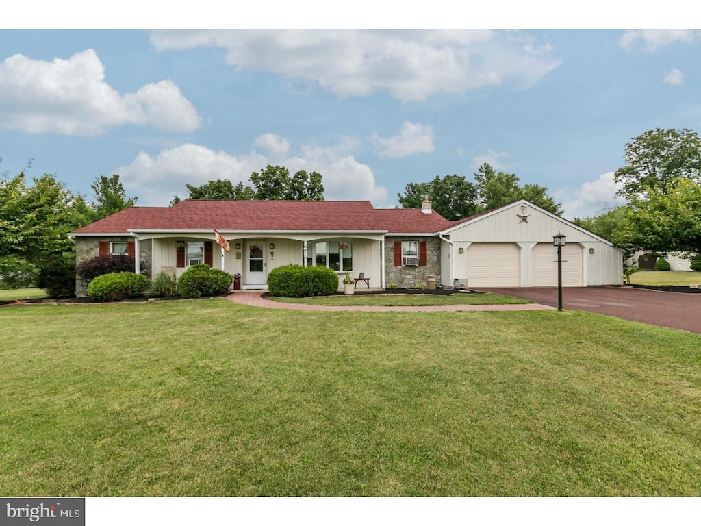 55 Elroy Rd, Souderton, PA 18964 - single story home featuring driveway, board and batten siding, a chimney, and a front lawn