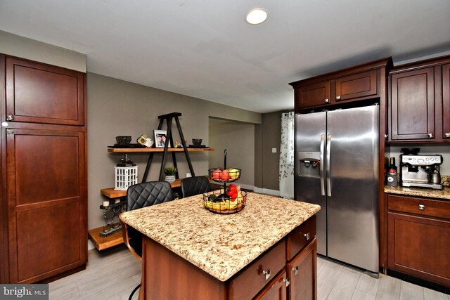 1437 Hilltop Rd, Pottstown, PA 19464 - kitchen with stainless steel refrigerator with ice dispenser, light wood-type flooring, a kitchen island, and light stone countertops