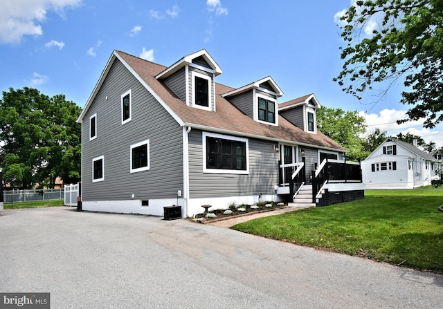 1437 Hilltop Rd, Pottstown, PA 19464 - new england style home featuring a front lawn, a wooden deck, and roof with shingles